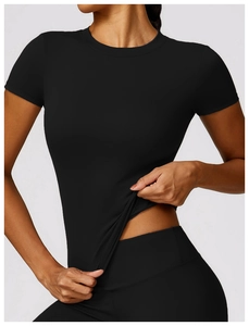Detail showing the superior elasticity and stretch of the quick-dry black yoga set fabric