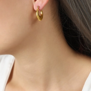 U-shaped gold plated titanium steel hoop earrings with textured geometric design