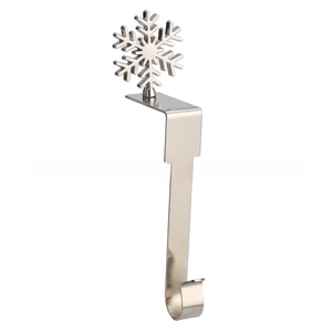 Close-up of a silver snowflake Christmas stocking holder for fireplace mantels