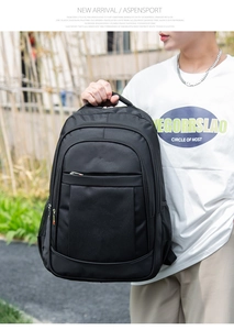 Side view of a large black business backpack with mesh side pocket and zipper compartments