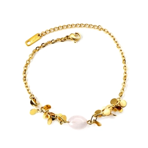 Vintage stainless steel gold bead bracelet featuring a light pink oval gemstone center