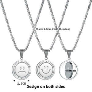 Detailed view of 360 degree rotating double sided smiley face pendant on a silver chain