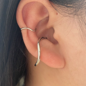 Silver geometric wave ear cuffs for women in a two-piece minimalist fashion set