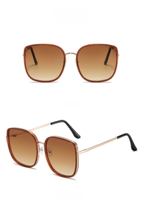 Detail of square oversized tea-colored sunglasses with gold metal temples in front and side views