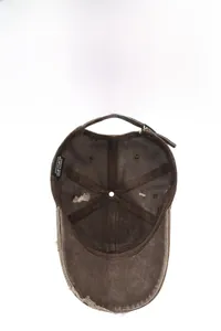 Detail of vintage washed cotton baseball cap showing inner stitching and worn fabric