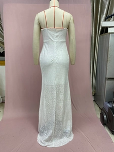 Detail of white sequin lace backless evening dress showing intricate texture and slim fit