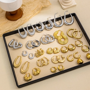 Collection of geometric heart and hoop titanium steel earrings in gold and silver