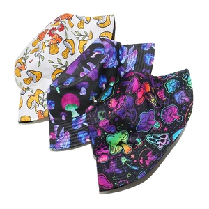 Three bucket hats featuring psychedelic mushroom patterns in white, black and neon colors