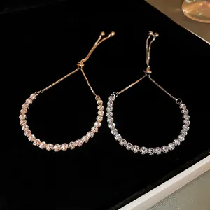 Adjustable zircon tennis bracelets in rose gold and silver on black velvet jewelry box