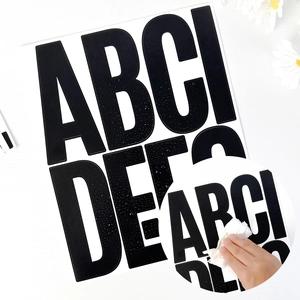 Detail of 5-inch black waterproof letter stickers showing easy cleaning of A-G characters