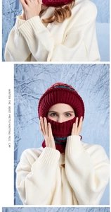 Detail of burgundy knitted winter balaclava with warm fleece lining and windproof neck cover