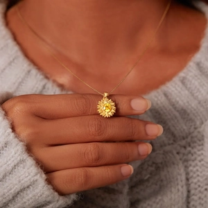 Elegant S925 sterling silver sunflower necklace with yellow gemstone on a model