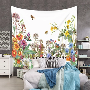 Detail of bohemian tapestry featuring hand-drawn wildflowers and bees on white fabric background