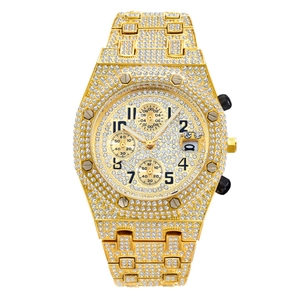 Iced out gold chronograph watch for men featuring a diamond encrusted dial and band