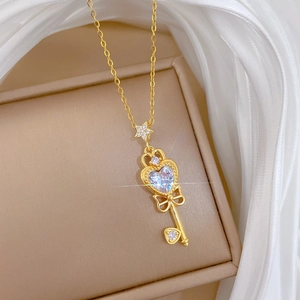 Golden key necklace with heart zirconia and star detail in luxury gift box