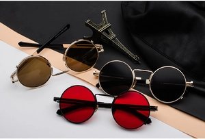 Close-up of steampunk round metal sunglasses in red, black, and tea lens variants