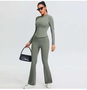 Slim fit gray yoga set featuring half-zip top and flared pants shown on a model