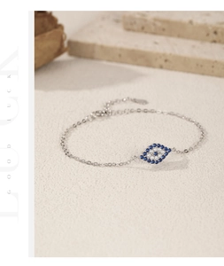 Macro detail of S925 sterling silver evil eye bracelet with blue and white zircon stones