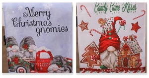Detail of linen Christmas table runner featuring festive gnomes and red truck design