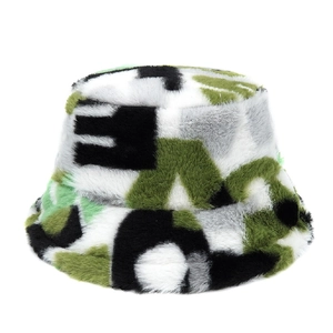 Detailed macro view of soft faux fur camouflage bucket hat with green and black plush texture