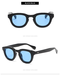 Detail view of round retro sunglasses with black frames and light blue transparent lenses