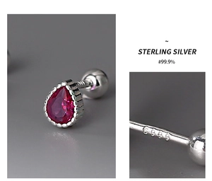 Macro detail of S999 sterling silver hallmark on pink teardrop rhinestone stud earrings