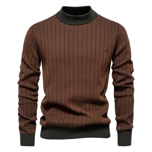 Detail of men's slim fit striped sweater with green mock neck and premium knit texture