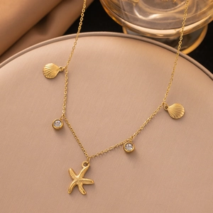 Collier exquis en or avec pendentifs étoile de mer, coquillages et zircon pour femme