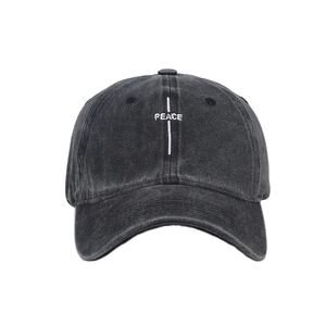 Vintage washed charcoal cotton baseball cap with white PEACE embroidery in street style