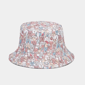 Close-up of high-density cartoon cat and dog pattern on cotton canvas bucket hat