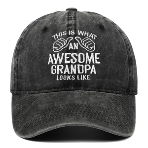 Detail of embroidered 'Awesome Grandpa' text on vintage washed denim baseball cap