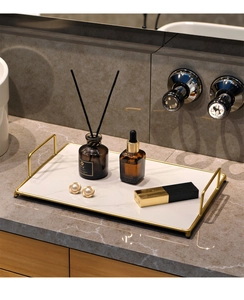 Detailed macro view of white marble texture tray with elegant golden metal handles