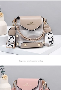 Detail of crossbody bags with chunky gold chains and stylish printed wide shoulder straps