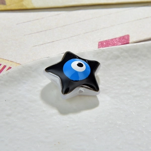Star-shaped resin evil eye bead in black and blue for DIY jewelry making