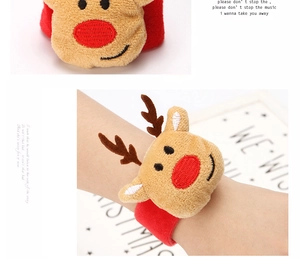 Detail of plush reindeer slap bracelet with soft brown fabric and festive red wristband