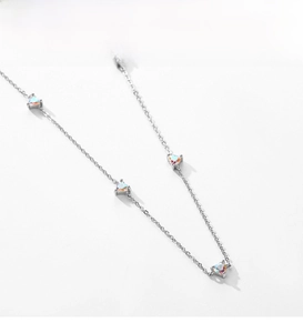 Detailed view of S925 silver necklace with shimmering colorful heart-shaped pendants