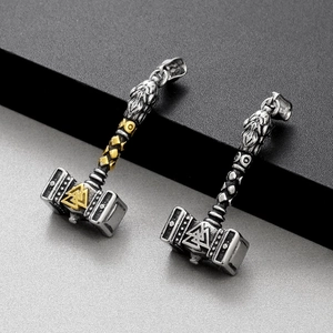 Detailed view of silver and gold stainless steel Viking Thor Hammer pendants with carvings