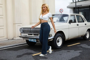 Detail of high-waisted wide-leg dark blue denim pants with vintage outdoor aesthetic