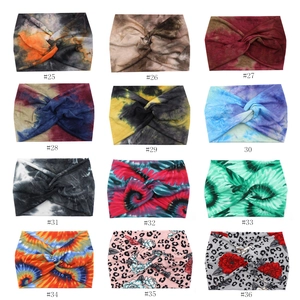 Grid display of 12 bohemian twisted headbands with diverse tie-dye and floral prints