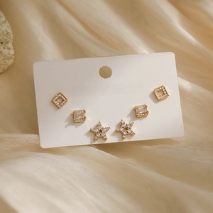 Miniature 18K gold plated copper stud earrings set with zircon in star and square shapes