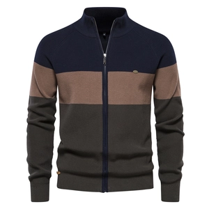 Detail of the high-quality color-block knit cardigan with stand collar and zipper