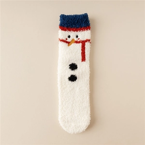 Detail of white coral fleece Christmas sock featuring a cute snowman design and blue plush cuff