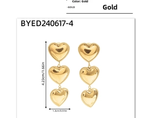 Detailed view of triple heart drop earrings in gold finish with size measurements