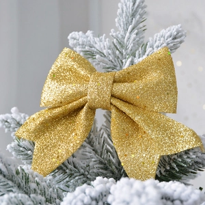 Sparkling gold glitter bow ornament for Christmas tree and festive wall decoration