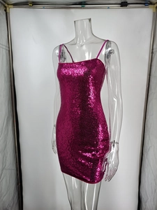 Close-up of vibrant rose red sequin mini dress with spaghetti straps on a mannequin