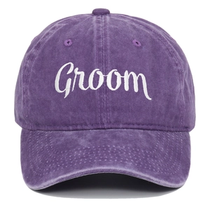 Detail of white Groom embroidery on a vintage purple washed cotton baseball cap