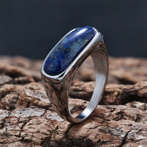 Macro shot of men's silver ring with rectangular blue lapis lazuli on wood bark