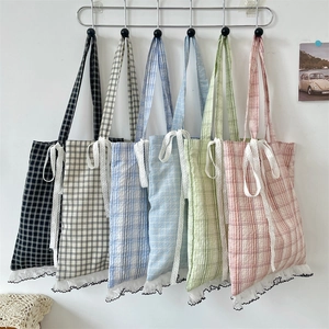 Plaid canvas tote bags in five colors featuring white lace bows and ruffled edges