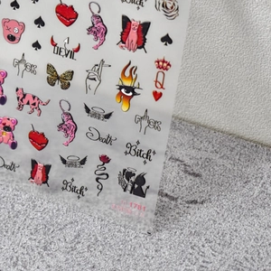 Detail of 5D embossed nail stickers featuring Y2K cat, heart, and butterfly patterns