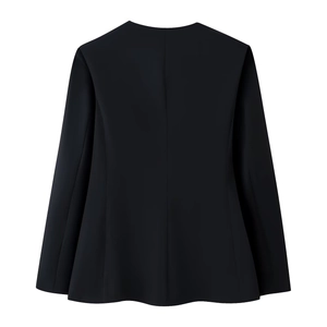 Detail view of the back of a black long-sleeved suit jacket with tailored seams and stitching
